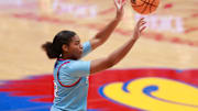 Kansas freshman guard S'Mya Nichols (12) shoots for three against Iowa State in the first half of the game Wednesday, Jan. 24, 2024, inside Allen Fieldhouse.