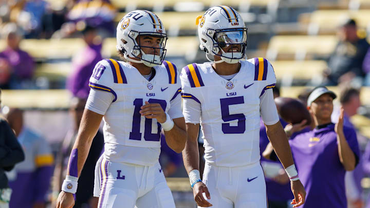 Nov 25, 2023; Baton Rouge, Louisiana, USA;  LSU Tigers quarterback Jayden Daniels (5) and  quarterback Rickie Collins (10) during warmups before the game against the Texas A&M Aggies at Tiger Stadium. Mandatory Credit: Stephen Lew-Imagn Images