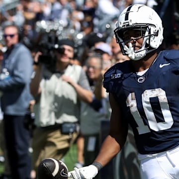 Penn State running back Nicholas Singleton runs into the end zone for a touchdown during the third quarter against the Bowling Green Falcons at Beaver Stadium.