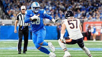 Detroit Lions offensive tackle Penei Sewell (58) carries the ball and run against Chicago Bears linebacker Jack Sanborn (57) during the first half at Ford Field in Detroit on Thursday, Nov. 28, 2024.