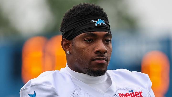 Detroit Lions defensive back Christian Izien (27) looks on 