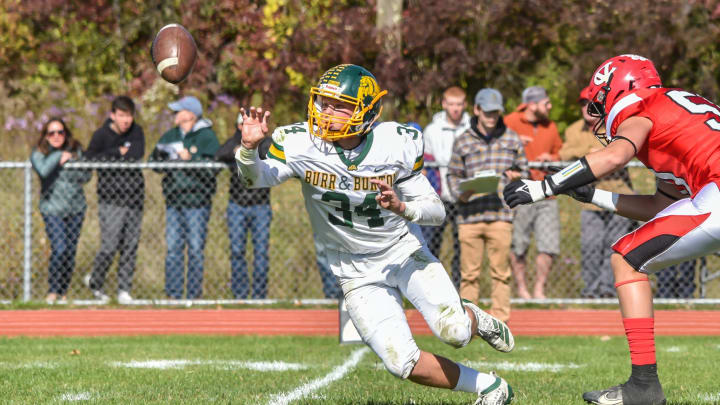 Burr and Burton's Jack McCoy pitches the ball to his running back during the Bulldogs' game vs the CVU Redhawks on Saturday afternoon in Hinesburg.

Football Burr And Burton At Cvu 08oct22 9011