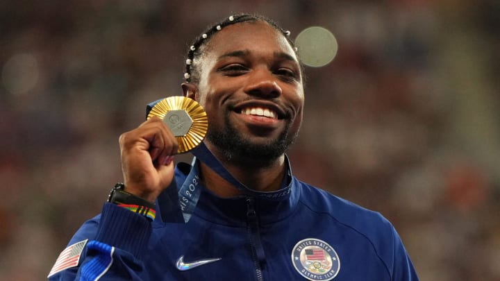 Aug 5, 2024: Noah Lyles celebrates with his gold medal at the victory ceremony for the men's 100m during the Paris 2024 Olympic Summer Games at Stade de France.