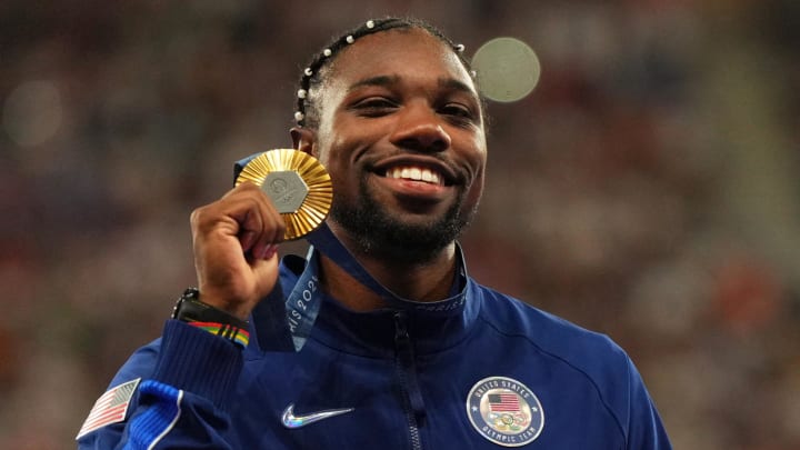 Aug 5, 2024: Noah Lyles celebrates with his gold medal at the victory ceremony for the men's 100m during the Paris 2024 Olympic Summer Games.