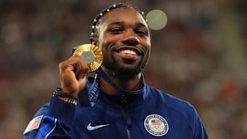 [US, Mexico & Canada customers only] Aug 5, 2024; Paris Saint-Denis, France; Noah Lyles (USA) celebrates with his gold medal at the victory ceremony for the men's 100m during the Paris 2024 Olympic Summer Games at Stade de France. Mandatory Credit: Aleksandra Szmigiel/Reuters via USA TODAY Sports