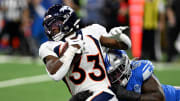 Dec 16, 2023; Detroit, Michigan, USA; Denver Broncos running back Javonte Williams (33) is tackled