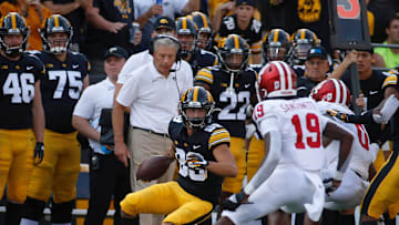 Iowa head football coach keeps an eye on junior receiver Nico Ragaini  s feet as he makes a play for a first down along the sidelines in the third quarter against Indiana at Kinnick Stadium in Iowa City on Saturday, Sept. 4, 2021.

20210904 Iowavsindiana