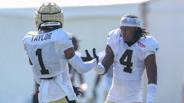 New Orleans Saints cornerback Kool-Aid McKinstry (4) shakes hands with cornerback Alontae Taylor 