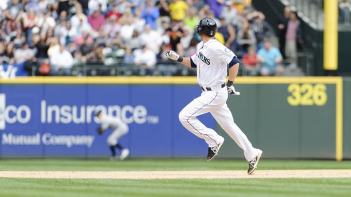 Seattle Mariners first baseman Alex Liddi (16) looks towards right field on his way to 2nd base after hitting a double against the New York Yankees during the 8th inning at Safeco Field in 2013.