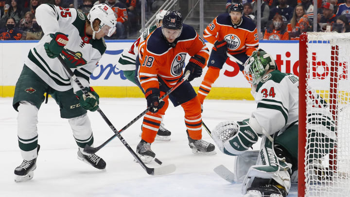 Feb 20, 2022; Edmonton, Alberta, CAN; Edmonton Oilers forward Zach Hyman (18) battles for a loose