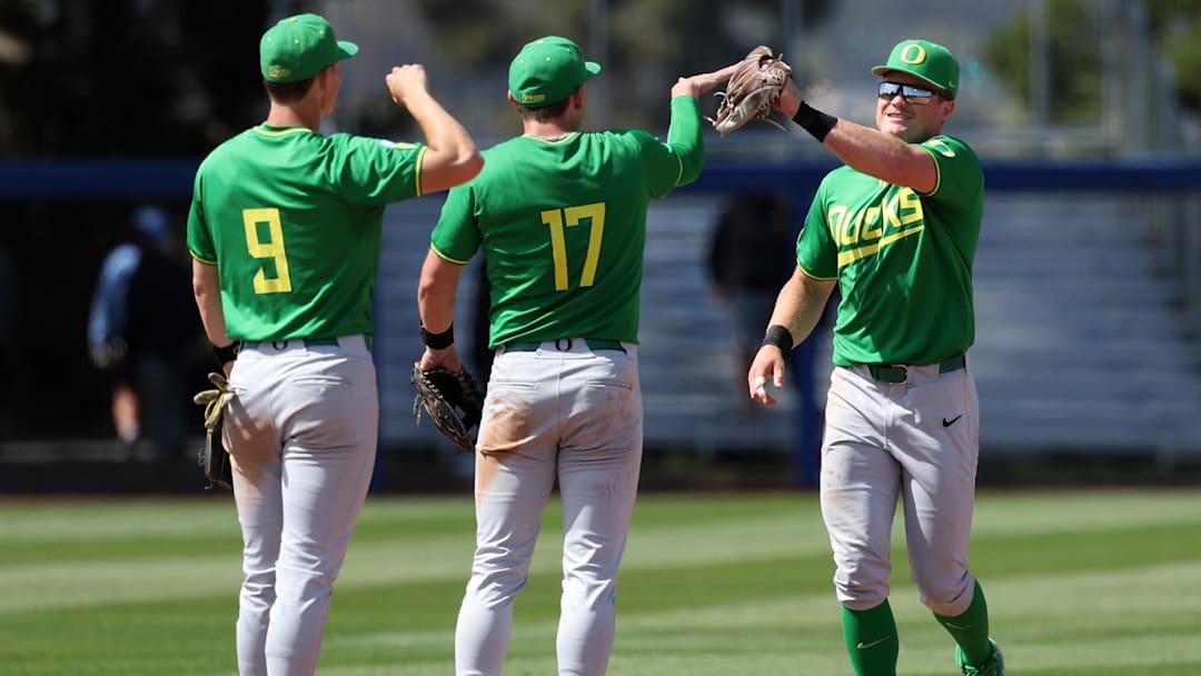 May 31, 2024; Santa Barbara, CA, USA;  Oregon outfielder Bryce Boettcher (28, R) celebrates with second baseman Drew Smith (17) after defeating San Diego 5-4 in extra innings of an NCAA Baseball Santa Barbara Regional game at Caesar Uyesaka Stadium.