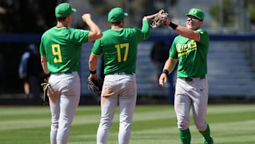 May 31, 2024; Santa Barbara, CA, USA;  Oregon outfielder Bryce Boettcher (28, R) celebrates with second baseman Drew Smith (17) after defeating San Diego 5-4 in extra innings of an NCAA Baseball Santa Barbara Regional game at Caesar Uyesaka Stadium.