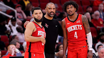 Mar 21, 2024; Houston, Texas, USA; Houston Rockets head coach Ime Udoka (center) talks with Houston Rockets guards Fred VanVleet (5) and Jalen Green (4) during the fourth quarter against the Chicago Bulls at Toyota Center. Mandatory Credit: Erik Williams-Imagn Images
