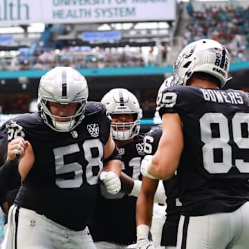Nov 17, 2024; Miami Gardens, Florida, USA; Las Vegas Raiders tight end Brock Bowers (89) celebrates with guard Jackson Powers-Johnson (58) after scoring a touchdown against the Miami Dolphins during the third quarter at Hard Rock Stadium. Mandatory Credit: Sam Navarro-Imagn Images