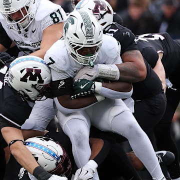 Nov 1, 2025; Minneapolis, Minnesota, USA; Michigan State Spartans running back Brandon Tullis (7) runs the ball against the Minnesota Golden Gophers during the first half at Huntington Bank Stadium. Mandatory Credit: Matt Krohn-Imagn Images