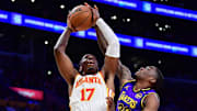 Atlanta Hawks center Onyeka Okongwu moves to the basket against Los Angeles Lakers guard Shake Milton.