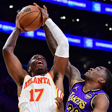 Atlanta Hawks center Onyeka Okongwu moves to the basket against Los Angeles Lakers guard Shake Milton.