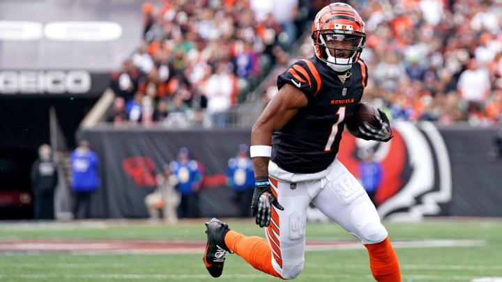 Cincinnati Bengals wide receiver Ja'Marr Chase (1) turns downfield after completing a catch 