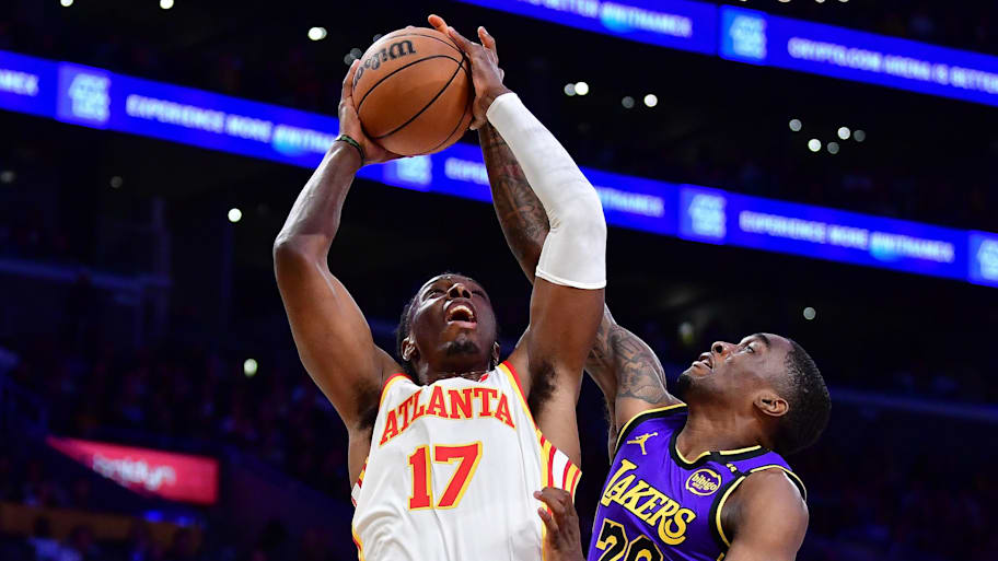 Atlanta Hawks center Onyeka Okongwu moves to the basket against Los Angeles Lakers guard Shake Milton. | Gary A. Vasquez-Imagn Images