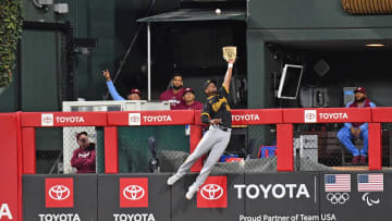 Apr 11, 2024; Philadelphia, Pennsylvania, USA; Pittsburgh Pirates outfielder Michael A. Taylor (18) tries to catch home run hit by Philadelphia Phillies third base Alec Bohm (28) (not pictured) during the fourth inning at Citizens Bank Park. Mandatory Credit: Eric Hartline-USA TODAY Sports
