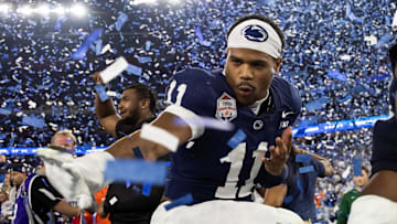 Dec 31, 2024; Glendale, AZ, USA; Penn State Nittany Lions defensive end Abdul Carter (11) celebrates with the Heisman pose after defeating the Boise State Broncos in the Fiesta Bowl at State Farm Stadium. Mandatory Credit: Mark J. Rebilas-Imagn Images