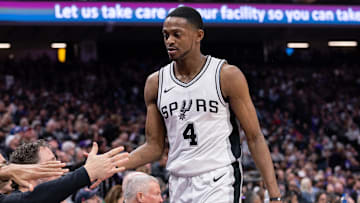 Mar 7, 2025; Sacramento, California, USA; San Antonio Spurs guard De'Aaron Fox (4) high fives team mates after coming out of the game during the fourth quarter at Golden 1 Center. Mandatory Credit: Ed Szczepanski-Imagn Images