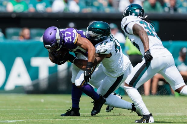 Former Husky running back Myles Gaskin (37) drags a Philadelphia tackler in the Minnesota Vikings' final exhibition game. 