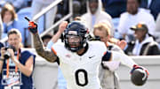 Oct 25, 2025; Chapel Hill, North Carolina, USA; Virginia Cavaliers safety Antonio Clary (0) celebrates after intercepting a pass near the end of the fourth quarter at Kenan Stadium. Mandatory Credit: Bob Donnan-Imagn Images