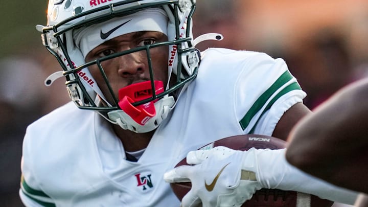 Lawrence North Wildcats Damario Moore (2) runs toward the end zone Friday, Oct. 4, 2024, during a football game between Warren Central and the Lawrence North Wildcats at Warren Central High School in Indianapolis.