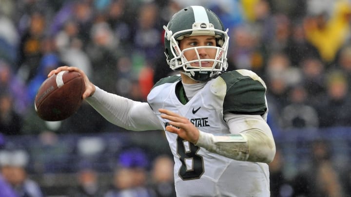 Nov 26, 2011; Evanston, IL, USA;  Michigan State Spartans quarterback Kirk Cousins (8) drops back to pass against the Northwestern Wildcats during the second half at Ryan Field. Michigan State defeats Northwestern 31-17. Mandatory Credit: Mike DiNovo-USA TODAY Sports