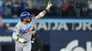 Nov 1, 2025; Toronto, Ontario, CAN; Los Angeles Dodgers second baseman Miguel Rojas (72) reacts after hitting a home run against the Toronto Blue Jays  in the ninth inning for game seven of the 2025 MLB World Series at Rogers Centre. Mandatory Credit: Nick Turchiaro-Imagn Images