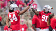 Sep 16, 2023; Columbus, Ohio, USA; Ohio State Buckeyes defensive end JT Tuimoloau (44) high fives defensive tackle Tyleik Williams (91) during the NCAA football game at Ohio Stadium. Ohio State won 63-10.