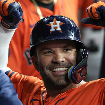 Jul 12, 2025; Houston, Texas, USA; Houston Astros left fielder Jose Altuve (27) celebrates his home run against the Texas Rangers by reacting to the TV cameras in the first inning at Daikin Park. 