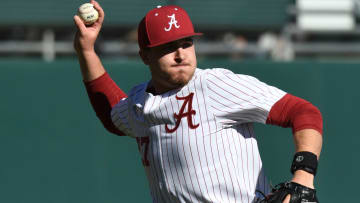 Feb 18, 2023; Bessemer, AL, USA; Alabama pitcher Ben Hess (27) fields a bunt and throws to first to record an out. The Crimson Tide faced Richmond in the season-opening series.

Sports Alabama Vs Richmond College Baseball