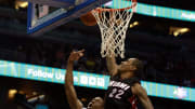 Oct 13, 2015; Orlando, FL, USA; Miami Heat forward Greg Whittington (22) blocks the shot of Orlando Magic guard Jordan Sibert (18) during the second half at Amway Center. Orlando Magic defeated the Miami Heat 95-92 in overtime. 