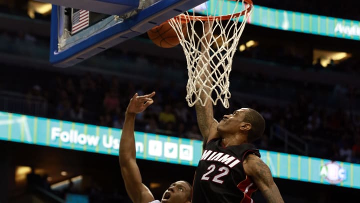 Oct 13, 2015; Orlando, FL, USA; Miami Heat forward Greg Whittington (22) blocks the shot of Orlando Magic guard Jordan Sibert (18) during the second half at Amway Center. Orlando Magic defeated the Miami Heat 95-92 in overtime. 