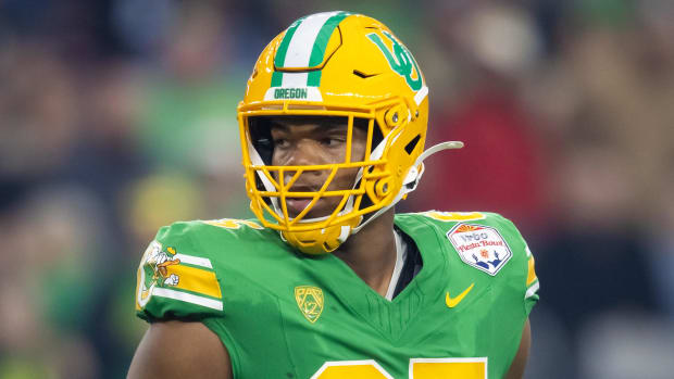 Oregon Ducks offensive lineman Ajani Cornelius (65) against the Liberty Flames during the 2024 Fiesta Bowl 