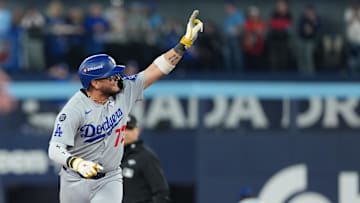 Nov 1, 2025; Toronto, Ontario, CAN; Los Angeles Dodgers second baseman Miguel Rojas (72) reacts after hitting a home run against the Toronto Blue Jays  in the ninth inning for game seven of the 2025 MLB World Series at Rogers Centre. Mandatory Credit: Nick Turchiaro-Imagn Images