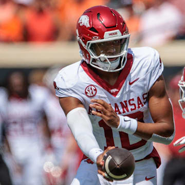 Arkansas Razorbacks quarterback Taylen Green (10) hands off to running back Ja'Quinden Jackson (22) during the second quarter against the Oklahoma State Cowboys at Boone Pickens Stadium.