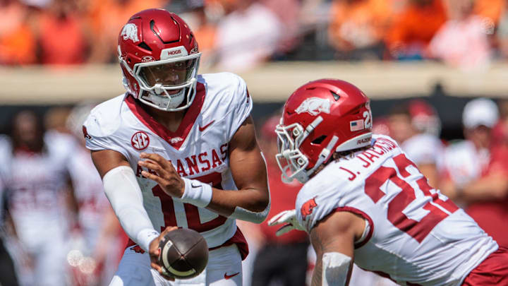 Arkansas Razorbacks quarterback Taylen Green (10) hands off to running back Ja'Quinden Jackson (22) during the second quarter against the Oklahoma State Cowboys at Boone Pickens Stadium.