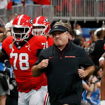 Georgia coach Kirby Smart leads his team onto the field before the start of the NCAA Aflac Kickoff Game in Atlanta, on Saturday, Aug. 31, 2024.