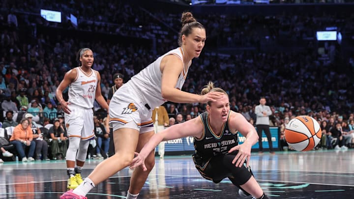 Sep 17, 2025; Brooklyn, New York, USA; Phoenix Mercury forward Kathryn Westbeld (24) and New York Liberty center Emma Meesseman (33) fight for a loose ball during game two of round one for the 2025 WNBA Playoffs at Barclays Center. Mandatory Credit: Wendell Cruz-Imagn Images Sep 17, 2025; Brooklyn, New York, USA; Phoenix Mercury forward Kathryn Westbeld (24) and New York Liberty center Emma Meesseman (33) fight for a loose ball during game two of round one for the 2025 WNBA Playoffs at Barclays Center. Mandatory Credit: Wendell Cruz-Imagn Images