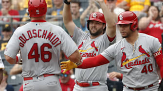 Aug 23, 2023; Pittsburgh, Pennsylvania, USA;  St. Louis Cardinals St. Louis Cardinals left fielder Alec Burleson (middle) and designated hitter catcher Willson Contreras (40) greet first baseman Paul Goldschmidt (46) crossing home plate to scoring a run against the Pittsburgh Pirates during the second inning at PNC Park. Mandatory Credit: Charles LeClaire-Imagn Images