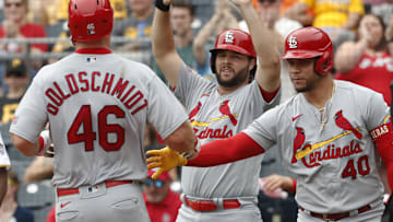 Aug 23, 2023; Pittsburgh, Pennsylvania, USA;  St. Louis Cardinals St. Louis Cardinals left fielder Alec Burleson (middle) and designated hitter catcher Willson Contreras (40) greet first baseman Paul Goldschmidt (46) crossing home plate to scoring a run against the Pittsburgh Pirates during the second inning at PNC Park. Mandatory Credit: Charles LeClaire-Imagn Images