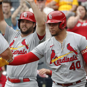 Aug 23, 2023; Pittsburgh, Pennsylvania, USA;  St. Louis Cardinals St. Louis Cardinals left fielder Alec Burleson (middle) and designated hitter catcher Willson Contreras (40) greet first baseman Paul Goldschmidt (46) crossing home plate to scoring a run against the Pittsburgh Pirates during the second inning at PNC Park. Mandatory Credit: Charles LeClaire-Imagn Images