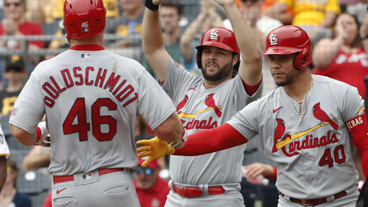 Aug 23, 2023; Pittsburgh, Pennsylvania, USA;  St. Louis Cardinals St. Louis Cardinals left fielder Alec Burleson (middle) and designated hitter catcher Willson Contreras (40) greet first baseman Paul Goldschmidt (46) crossing home plate to scoring a run against the Pittsburgh Pirates during the second inning at PNC Park. Mandatory Credit: Charles LeClaire-Imagn Images