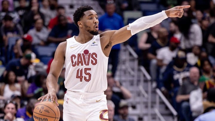 Mar 13, 2024; New Orleans, Louisiana, USA; Cleveland Cavaliers guard Donovan Mitchell (45) brings the ball up court against the New Orleans Pelicans during the first half of the game at Smoothie King Center. Mandatory Credit: Stephen Lew-USA TODAY Sports