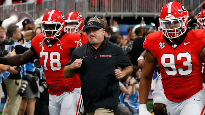 Georgia coach Kirby Smart leads his team onto the field before the start of the NCAA Aflac Kickoff Game in Atlanta, on Saturday, Aug. 31, 2024.