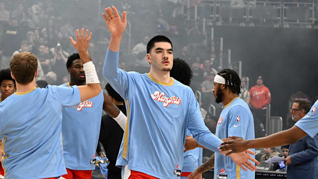 Memphis Grizzlies center Zach Edey (14) gives out high fives while getting introduced.