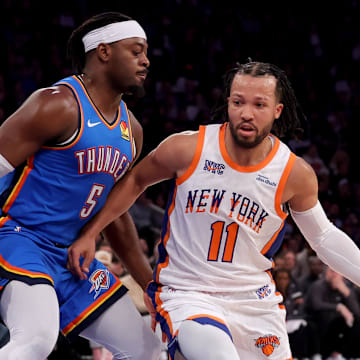 Jan 10, 2025; New York, New York, USA; New York Knicks guard Jalen Brunson (11) drives to the basket against Oklahoma City Thunder guard Luguentz Dort (5) during the third quarter at Madison Square Garden. Mandatory Credit: Brad Penner-Imagn Images